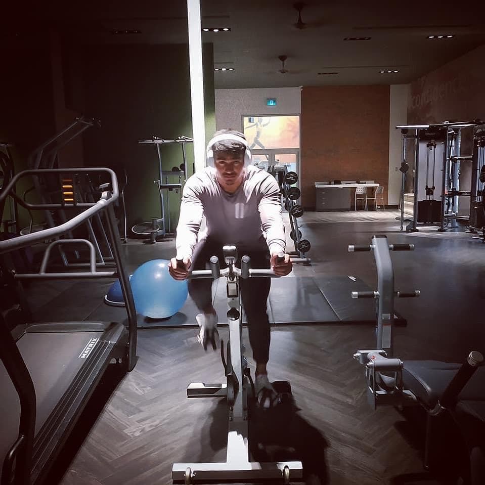 KT training on a stationary bike in the gym
